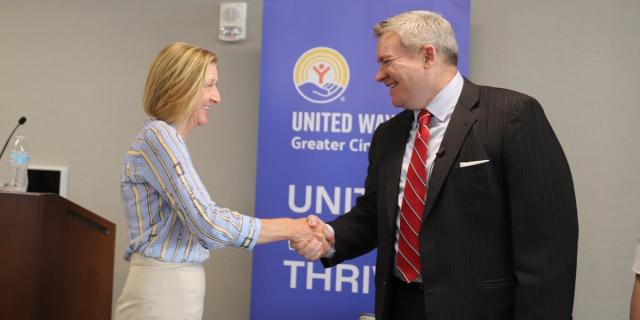 United Way President and CEO Moira Weir shaking hands with Ohio Department of Higher Education Chancellor Mike Duffey