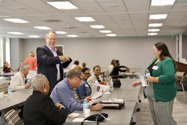 Hailey Barr, Public Policy & Advocacy Manager, mingles with breakfast attendees.